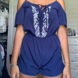 Navy romper with white floral embroidery